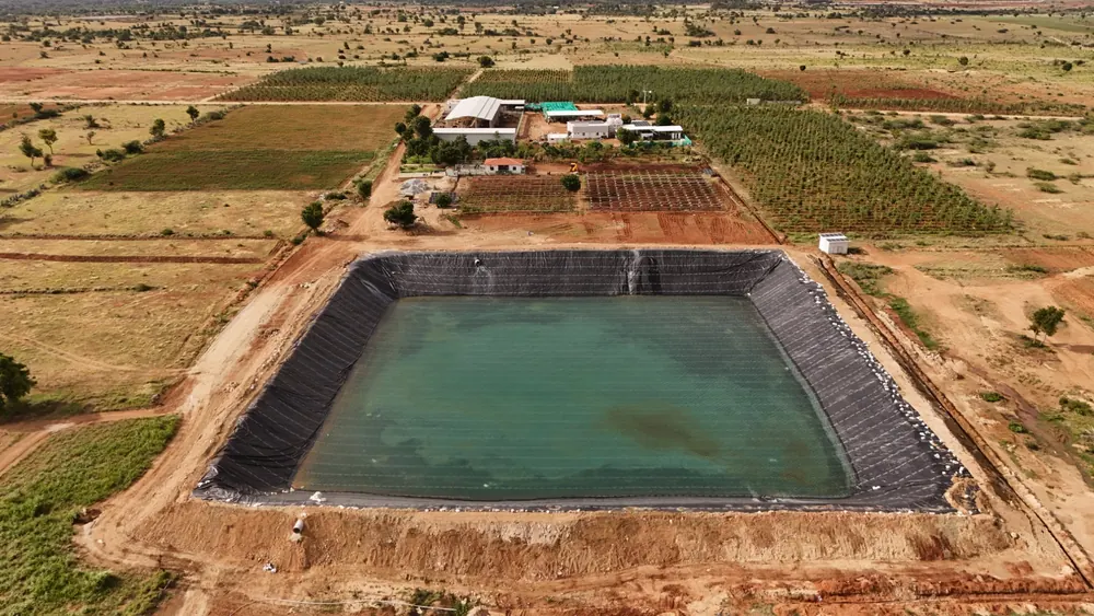 Lined farm pond for irrigation at GreenX farmland, Hindupur–Madakasira highway