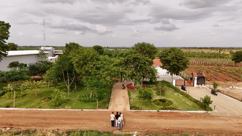 Visitors at the GreenX farm entrance near Lepakshi